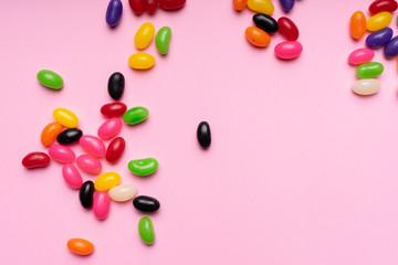 colourful jelly beans candies pink background Top view