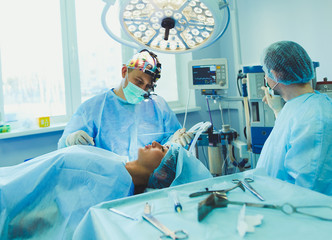 Man surgeon at work in operating room