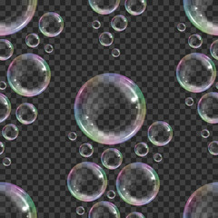 Seamless pattern with realistic floating soap bubbles with rainbow reflection on transparent background. Design element for advertising booklet, flyer or poster