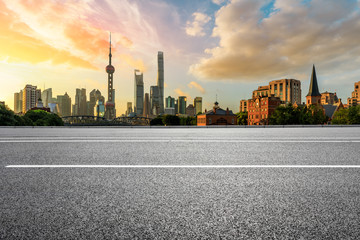 Fototapeta na wymiar Empty highway and beautiful city buildings scenery at sunrise in Shanghai,China.