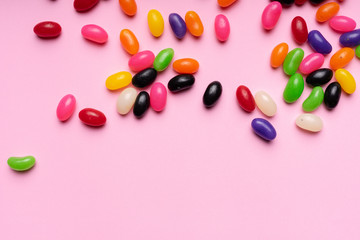 colourful jelly beans candies pink background Top view