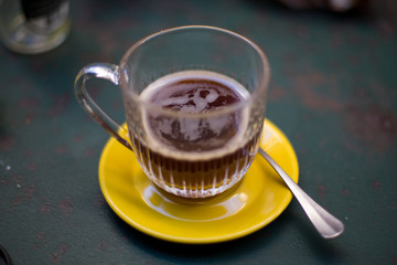cup of coffee and cup on garden table