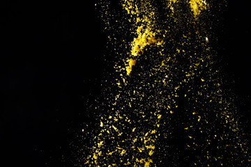 Powder particles on black background