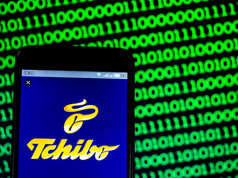 Kiev, Ukraine, April 18, 2019, illustrative editorial. In this photo illustration a Tchibo (part of Maxinvest) logo seen displayed on a smart phone