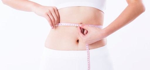 Woman Hand holding measurement tape on waist