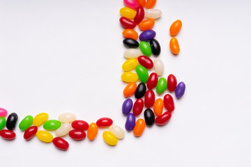Obraz premium colorful jelly beans candies white background Top view