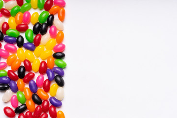 Obraz premium colorful jelly beans candies white background Top view