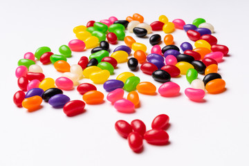 colorful jelly beans candies white background Top view