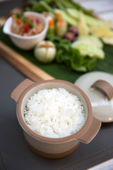 Obraz na płótnie Canvas Steamed rice in pot serve on table