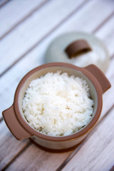 Steamed rice in pot serve on table