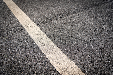 Obraz premium Asphalt With White Line Up Close 