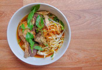 Thai noodle soup with chicken and vegetables.	