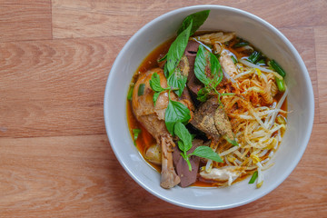 Thai noodle soup with chicken and vegetables.	