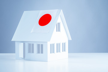 Layout of the house with the flag of Japan. Moving to Japan. Immigration abroad. Moving to Tokyo. Buying a house in Tokyo. Real estate acquisition. Accommodation in Japan.