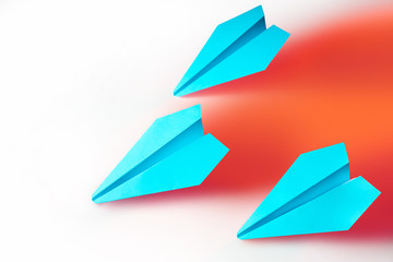 Origami. Take off three paper airplane. Teamwork. Joint achievement of goals. Take the example of a leader. Movement in a given direction.