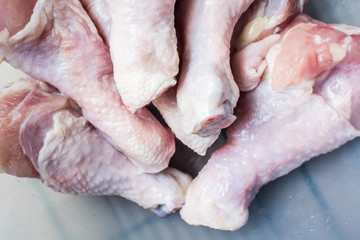 Raw chicken legs for cooking.