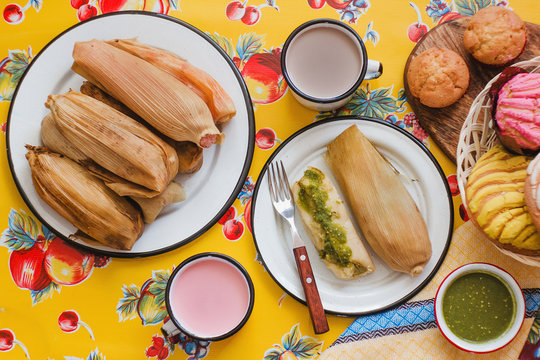 mexican tamales of corn leaves with green sauce and atole, Tamales Breakfast in Mexico
