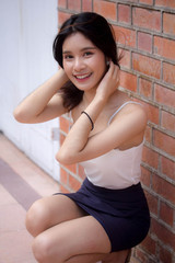 Portrait of thai china adult beautiful girl White shirt relax and smile