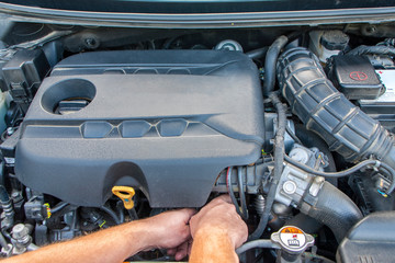 mechanic repairs car engine
