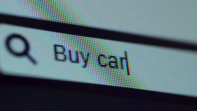 Browser bar with Buy Car text typed on the computer screen. Shot in 4k resolution