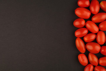 tomato cherry on black background