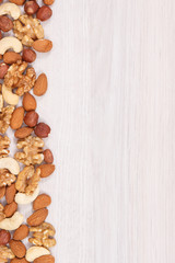 Different nuts and almonds as source vitamins and minerals, copy space for text