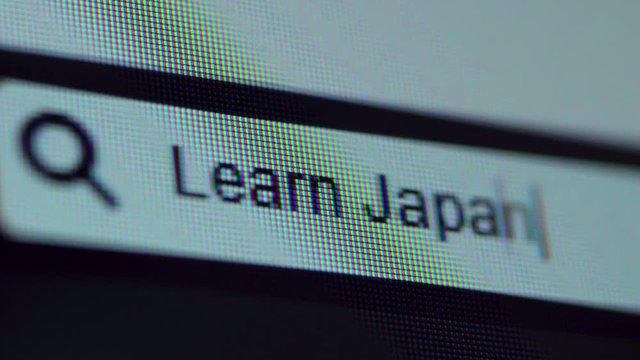 Browser bar with Learn Japanese text typed on the computer monitor. Shot in 4k resolution
