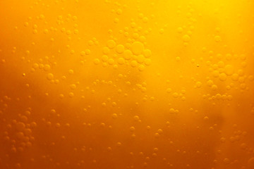 Bubbles on beer background. Circle and liquid pattern. Yellow circle and liquid pattern.
