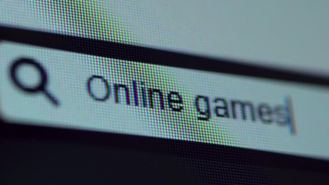 Browser bar with Online Games text typed on the computer screen. Shot in 4k resolution