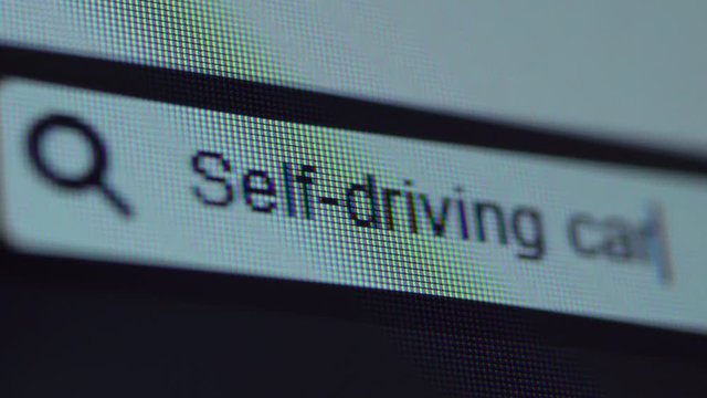 Browser bar with Self-Driving Cars text typed on the computer screen. Shot in 4k resolution