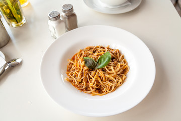 Dish of pasta on round white plate
