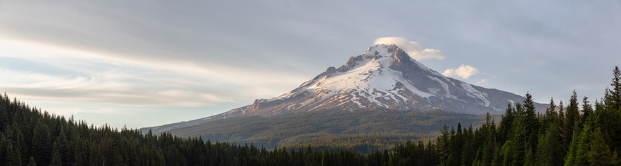 Fototapeta na wymiar Beautiful Panoramic Landscape View of Mt Hood during a dramatic cloudy sunset. Taken from Trillium Lake, Mt. Hood National Forest, Oregon, United States of America.