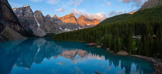 Beautiful Panoramic view of an Iconic Famous Place, Moraine Lake, during a vibrant summer sunrise....