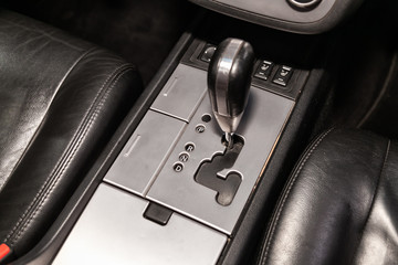  close-up of the accelerator handle and buttons. automatic transmission gear of car , car interior