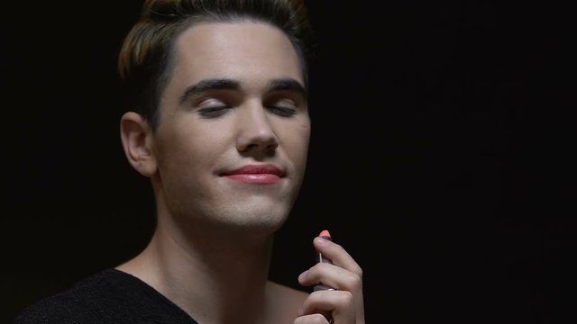 Transgender applying lipstick, gender dysphoria, lgbt community, self-expression