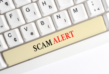 Writing note showing Scam Alert. Business concept for unsolicited email that claims the prospect of...