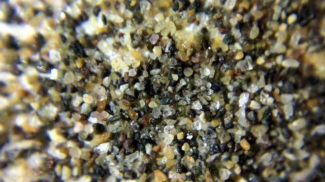 Macroscopic view of sand rotation.Using macro lens to capture microscopic details. Close up of sand detail.Top view.
