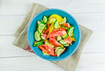 salad with cucumbers and tomatoes on white background