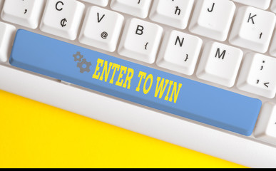 Text sign showing Enter To Win. Business photo text exchanging something value for prize or chance of winning White pc keyboard with empty note paper above white background key copy space