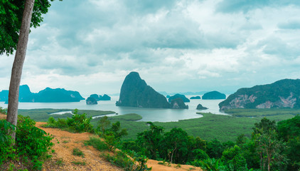 Unidentified people sightseeing at Samet Nang She point looking through Phang Nga Bay in Phang Nga, Thailand