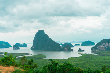 Unidentified people sightseeing at Samet Nang She point looking through Phang Nga Bay in Phang Nga, Thailand