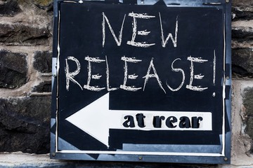 Obraz premium Word writing text New Release. Business photo showcasing announcing something newsworthy recent product Advertisement concept with empty copy space on the road sign