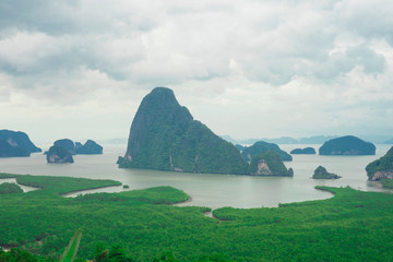 Unidentified people sightseeing at Samet Nang She point looking through Phang Nga Bay in Phang Nga, Thailand