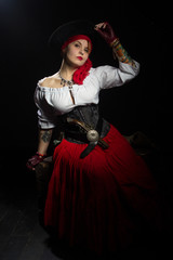 Woman pirate in hat, white blouse and red skirt