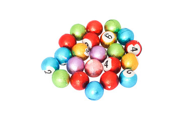 wrapped colorful chocolate balls on white background

