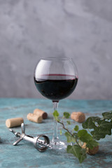 A glass with red wine. The concept of winemaking. Place under your text. Still life on a textural background.