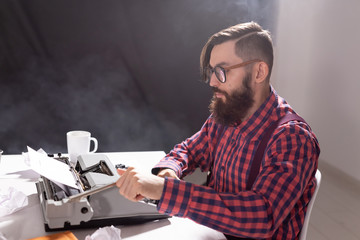 people, writer and hipster concept - young stylish writer working on typewriter