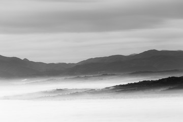 A view of Umbria valley with hills and mist