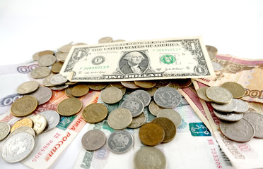 dollar bill on paper rubles and coins