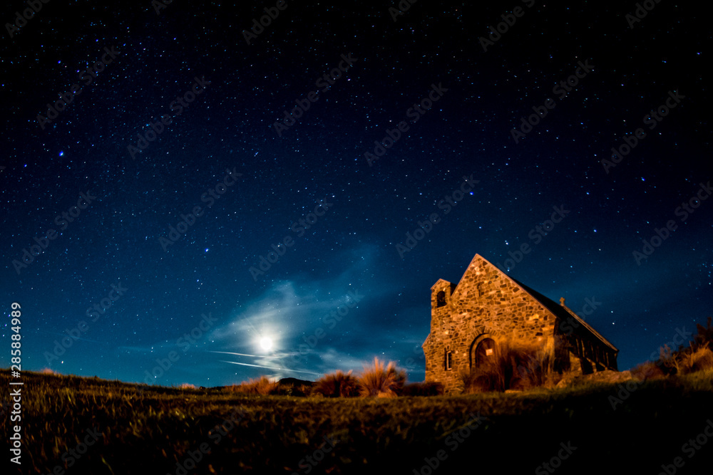 Wall mural background night sky with stars and moon at tekapo lake south island new zealand